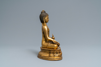 A Tibetan gilt bronze figure of Buddha, early 20th C.