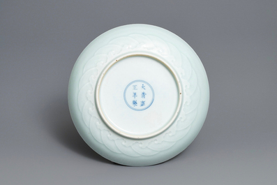 A Chinese celadon saucer dish with underglaze design, Yongzheng mark and poss. of the period