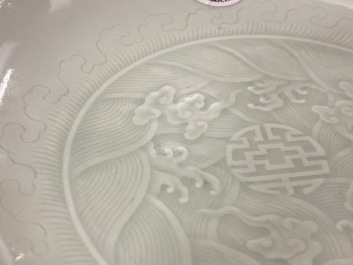 A Chinese celadon saucer dish with underglaze design, Yongzheng mark and poss. of the period