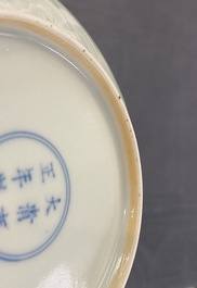 A Chinese celadon saucer dish with underglaze design, Yongzheng mark and poss. of the period