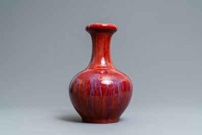 A Chinese monochrome flamb&eacute; sang-de-boeuf bottle vase, 19th C.