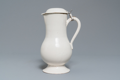 A white Delftware jug and cover, 18th C.