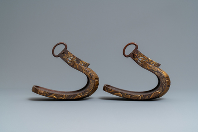 A Japanese gilt-lacquered 'kura' saddle with matching 'abumi' stirrups, Muromachi, 16th C.