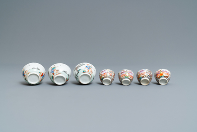 Seven Chinese famille rose 'Mandarin' cups and saucers, Qianlong