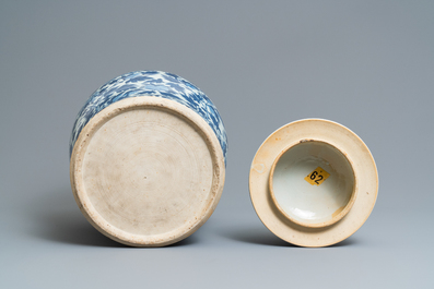 A pair of Chinese blue and white vases and covers with phoenixes, 19th C.