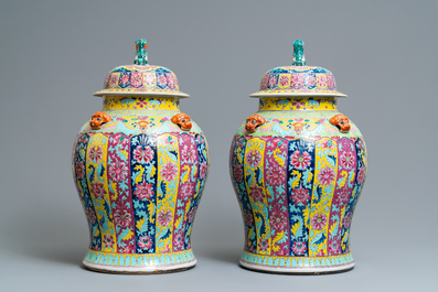 A pair of large Chinese famille rose vases and covers, 19th C.