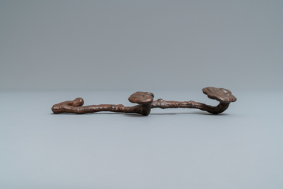 A Chinese cast iron brush rest in the shape of a lingzhi ruyi scepter, Ming