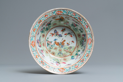 A Chinese Canton famille rose tureen and cover, a plate and a famille rose 'butterfly' bowl, 19th C.