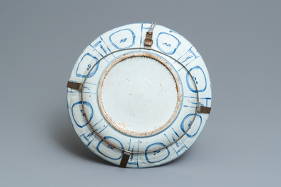 A Chinese blue and white kraak porcelain charger, a vase, a crow cup and a small plate, Wanli