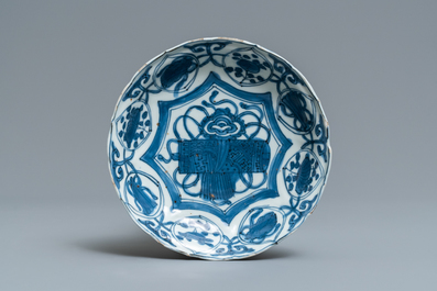 A Chinese blue and white kraak porcelain charger, a vase, a crow cup and a small plate, Wanli