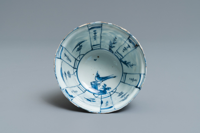 A Chinese blue and white kraak porcelain charger, a vase, a crow cup and a small plate, Wanli