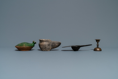 Fifteen islamic bronze and pottery oil lamps, 16th C. and later