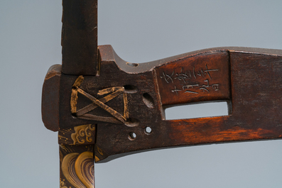 A Japanese gilt-lacquered 'kura' saddle with matching 'abumi' stirrups, Muromachi, 16th C.