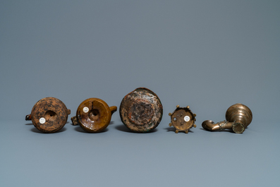 Fifteen islamic bronze and pottery oil lamps, 16th C. and later