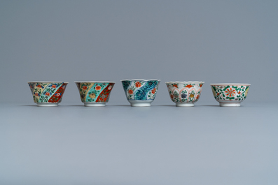 Eleven Chinese famille verte cups and saucers, Kangxi