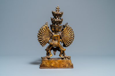 A large Sino-Tibetan coral-inlaid gilt bronze figure of Kapaladhara Hevajra, 18/19th C.