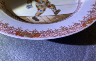 A Chinese 'South Sea Bubble' plate with the Commedia dell'arte figure Harlequin, Kangxi/Yongzheng