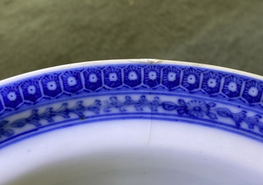 A Chinese blue and white bowl with an unusual scene with slaves, Qianlong