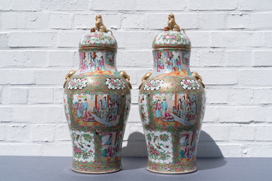 A pair of Chinese Canton famille rose vases and covers, 19th C.