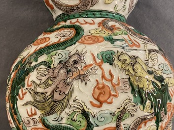 A Chinese famille verte relief-moulded double gourd 'dragon' vase on wooden stand, 19/20th C.