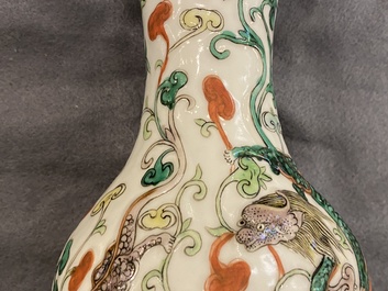 A Chinese famille verte relief-moulded double gourd 'dragon' vase on wooden stand, 19/20th C.