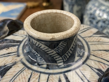 A pair of Chinese blue, white and copper-red meiping crackle-glazed vases, 19th C.