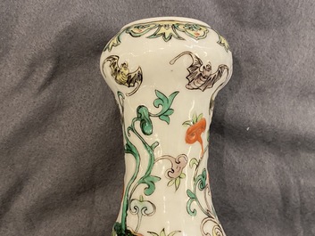 A Chinese famille verte relief-moulded double gourd 'dragon' vase on wooden stand, 19/20th C.