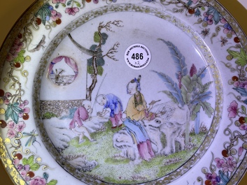 A pair of Chinese famille rose plates with figures in a garden, Yongzheng