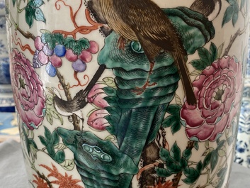 A pair of Chinese famille rose vases with birds among blossoms, 19th C.