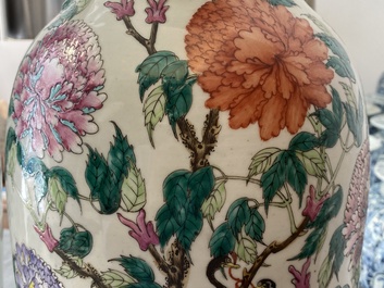 A pair of Chinese famille rose vases with birds among blossoms, 19th C.