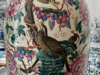 A pair of Chinese famille rose vases with birds among blossoms, 19th C.