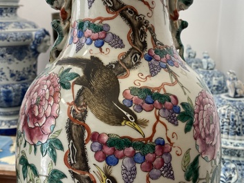 A pair of Chinese famille rose vases with birds among blossoms, 19th C.