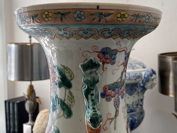 A pair of Chinese famille rose vases with birds among blossoms, 19th C.