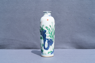 A Chinese wucai rouleau vase with figures in a landscape, Transitional period