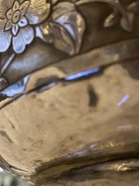 A pair of exceptional large Chinese relief-decorated silver vases, 19th C.