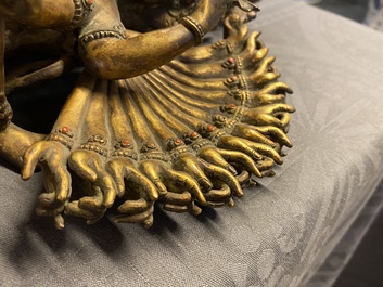 A large Sino-Tibetan coral-inlaid gilt bronze figure of Kapaladhara Hevajra, 18/19th C.