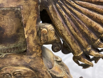 A large Sino-Tibetan coral-inlaid gilt bronze figure of Kapaladhara Hevajra, 18/19th C.