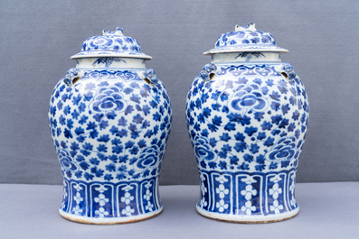 Two pairs of Chinese blue and white vases and covers, 19/20th C.