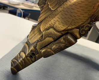 A Japanese gilt-lacquered 'kura' saddle with matching 'abumi' stirrups, Muromachi, 16th C.