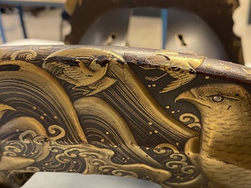 A Japanese gilt-lacquered 'kura' saddle with matching 'abumi' stirrups, Muromachi, 16th C.