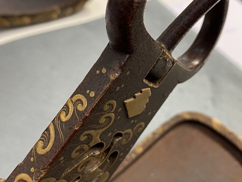 A Japanese gilt-lacquered 'kura' saddle with matching 'abumi' stirrups, Muromachi, 16th C.