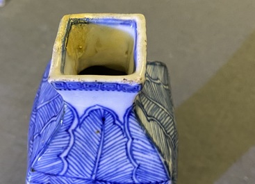 A pair of square Chinese blue and white covered vases and a tea caddy, Kangxi