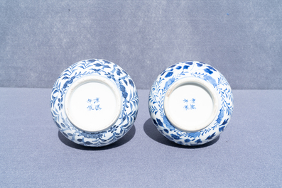 A pair of Chinese blue and white bottle vases with dragons, 19th C.