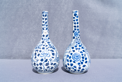 A pair of Chinese blue and white bottle vases with dragons, 19th C.