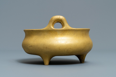 A Chinese gilt bronze tripod censer, Xuande mark, 19/20th C.