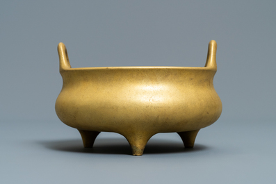 A Chinese gilt bronze tripod censer, Xuande mark, 19/20th C.