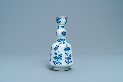 A Chinese blue and white elongated huqqa base with floral design, Kangxi