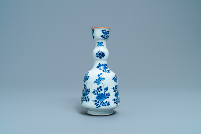 A Chinese blue and white elongated huqqa base with floral design, Kangxi