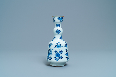 A Chinese blue and white elongated huqqa base with floral design, Kangxi