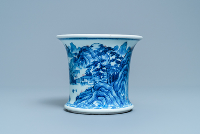 A fine Chinese blue, white and copper red 'Master of the Rocks' brush pot, Kangxi